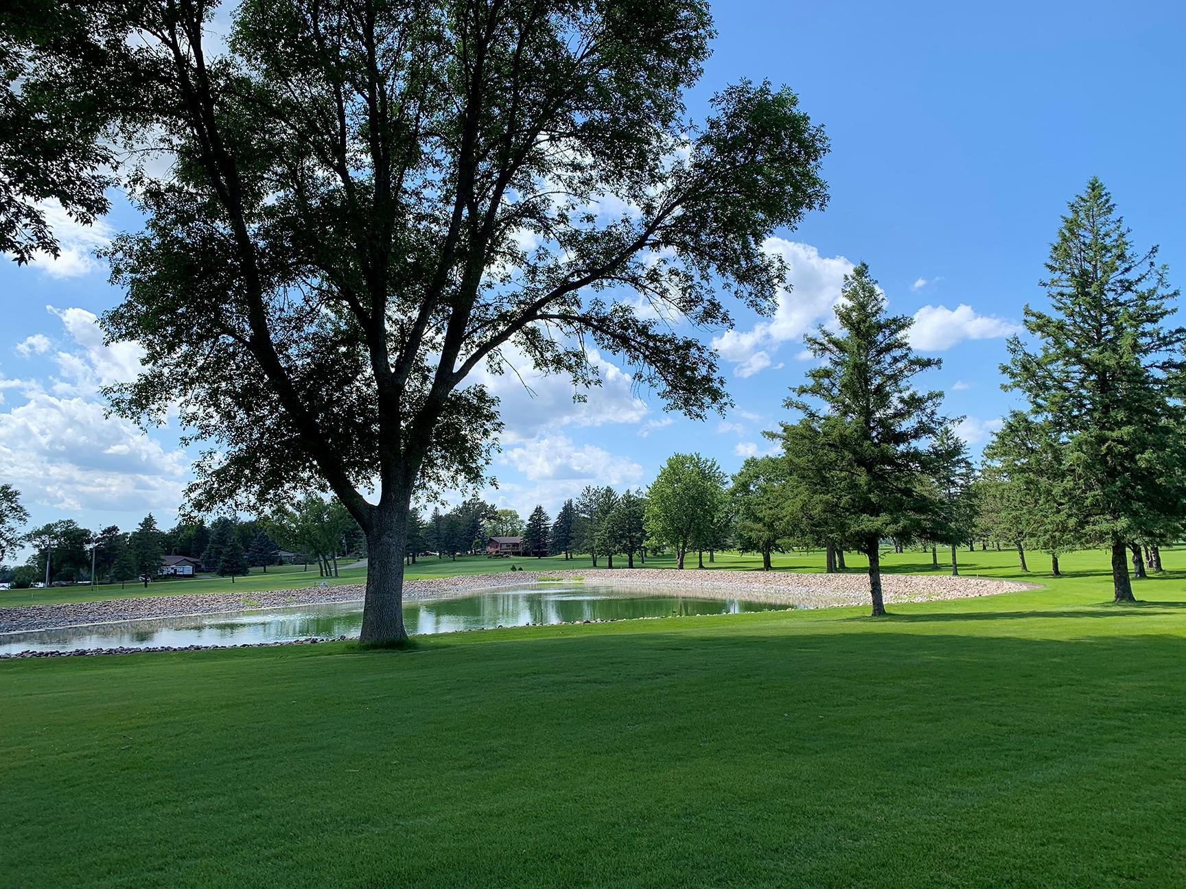 pond with clubhouse in background July 2025.jpg