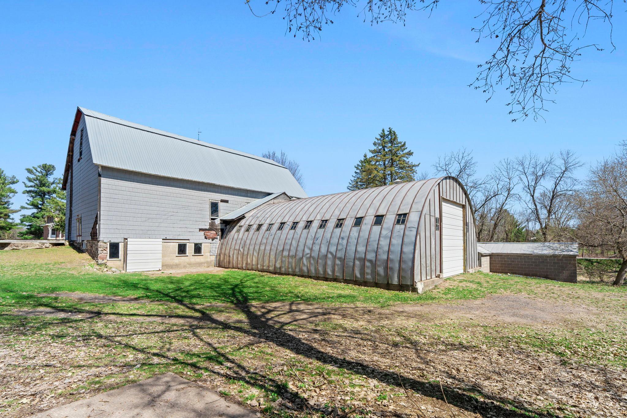 Huge steel dome shed is approximately 1170 sf... some people see machinery storage- I see indoor batting cage potential!