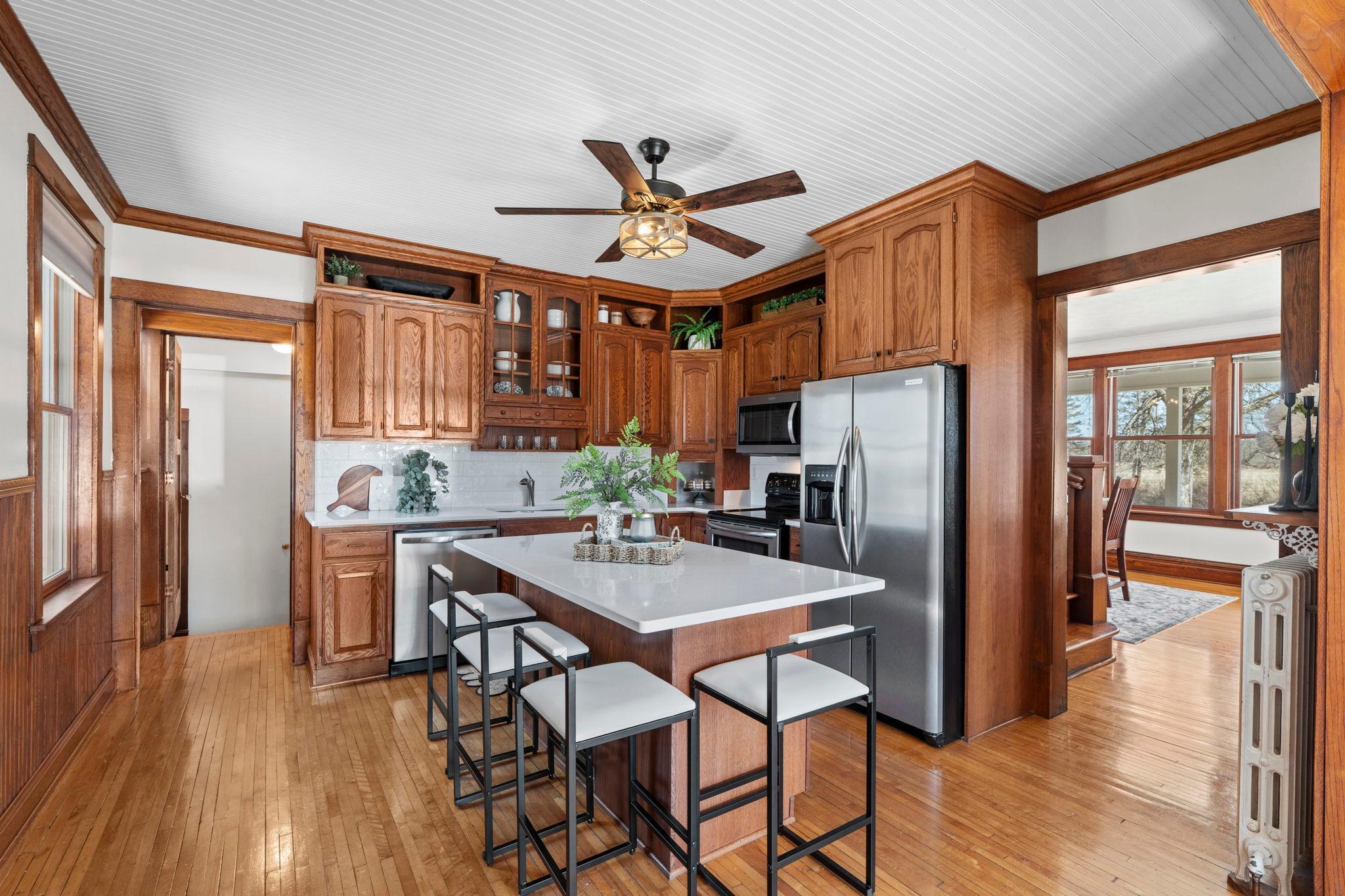 Kitchen updates include- new countertops, backsplash, dishwasher, and lighting.