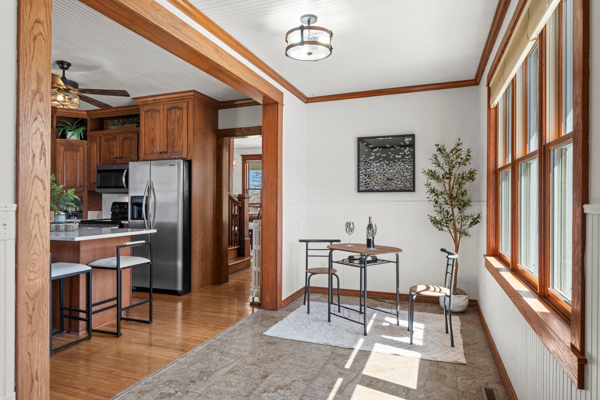 The side entrance welcomes you with a nice coat closet, freshly painted walls, new flooring installed next to original hardwood flooring throughout the main level and partial upper level bedrooms and hallway.