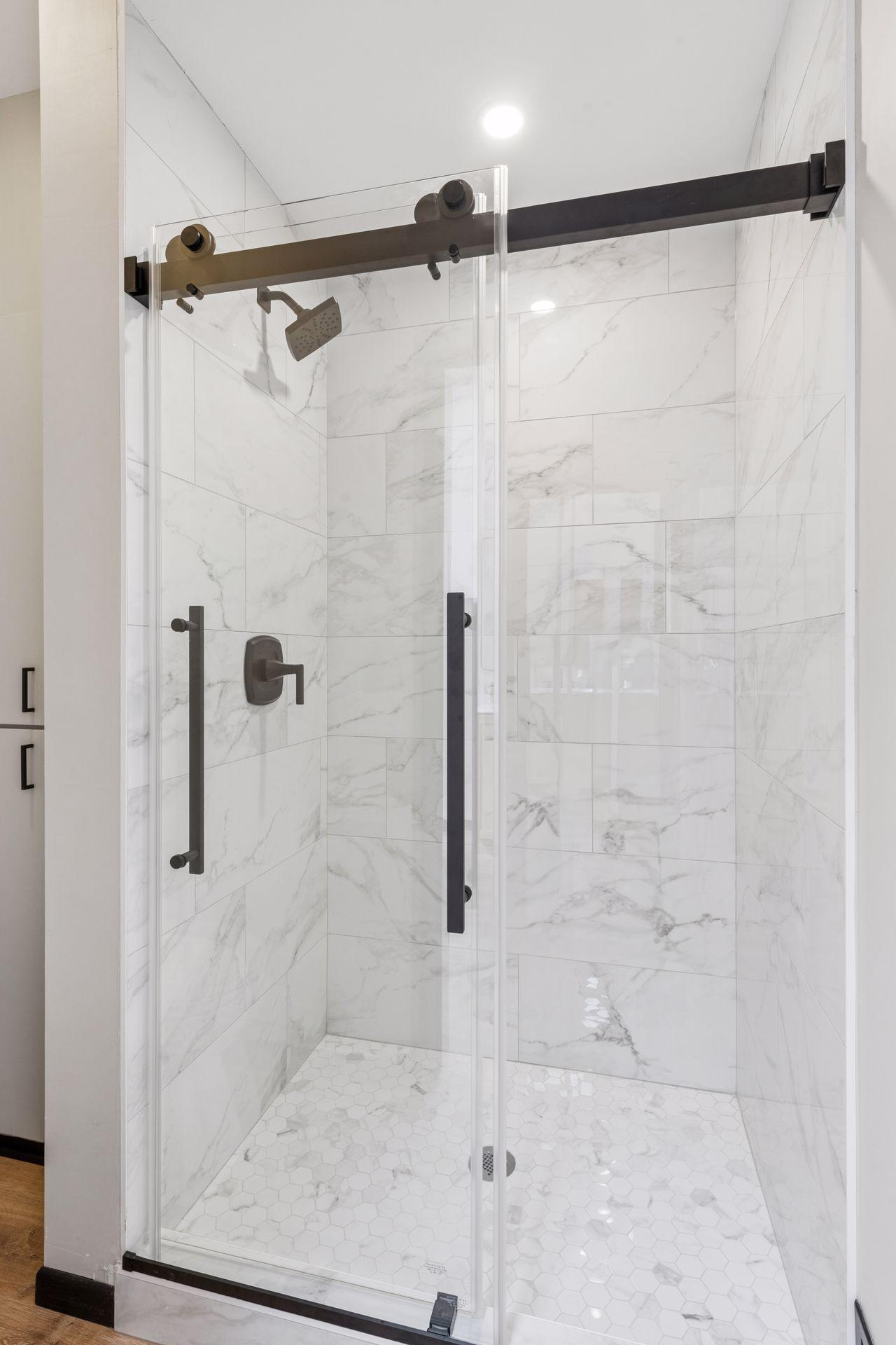 Primary ensuite bath has a separate room with step-in shower and toilet.