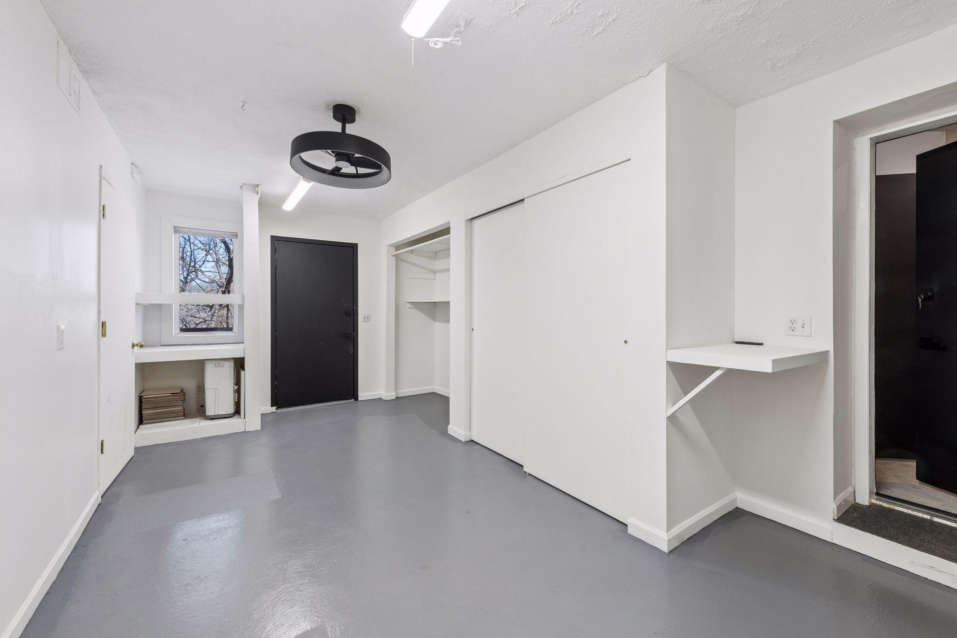 Lower level sits between the main level and basement, and includes three workshop/storage spaces, with direct access to the deck.