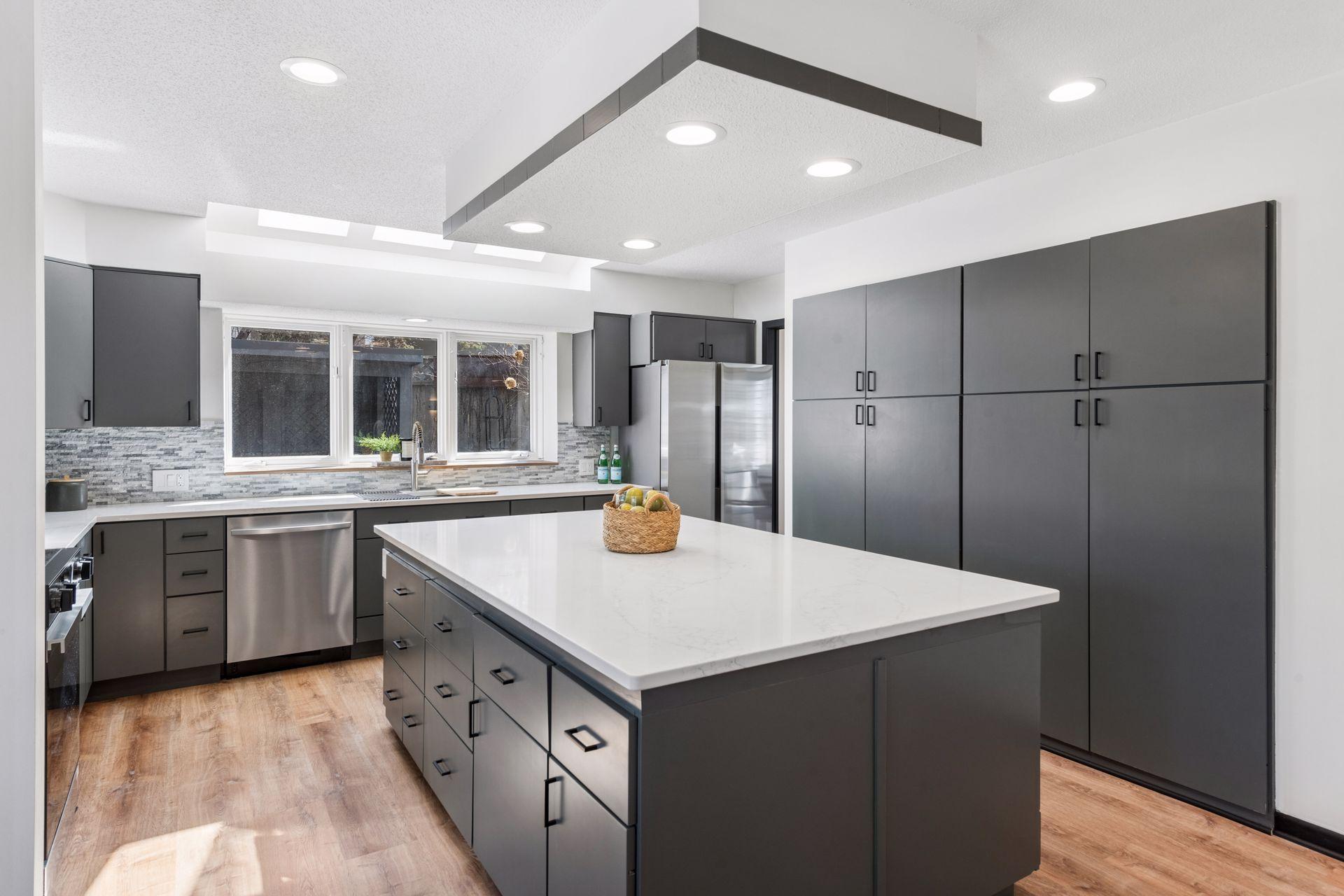 Enameled cabinetry, brand new stainless steel appliances, new counters and stylish backsplash.