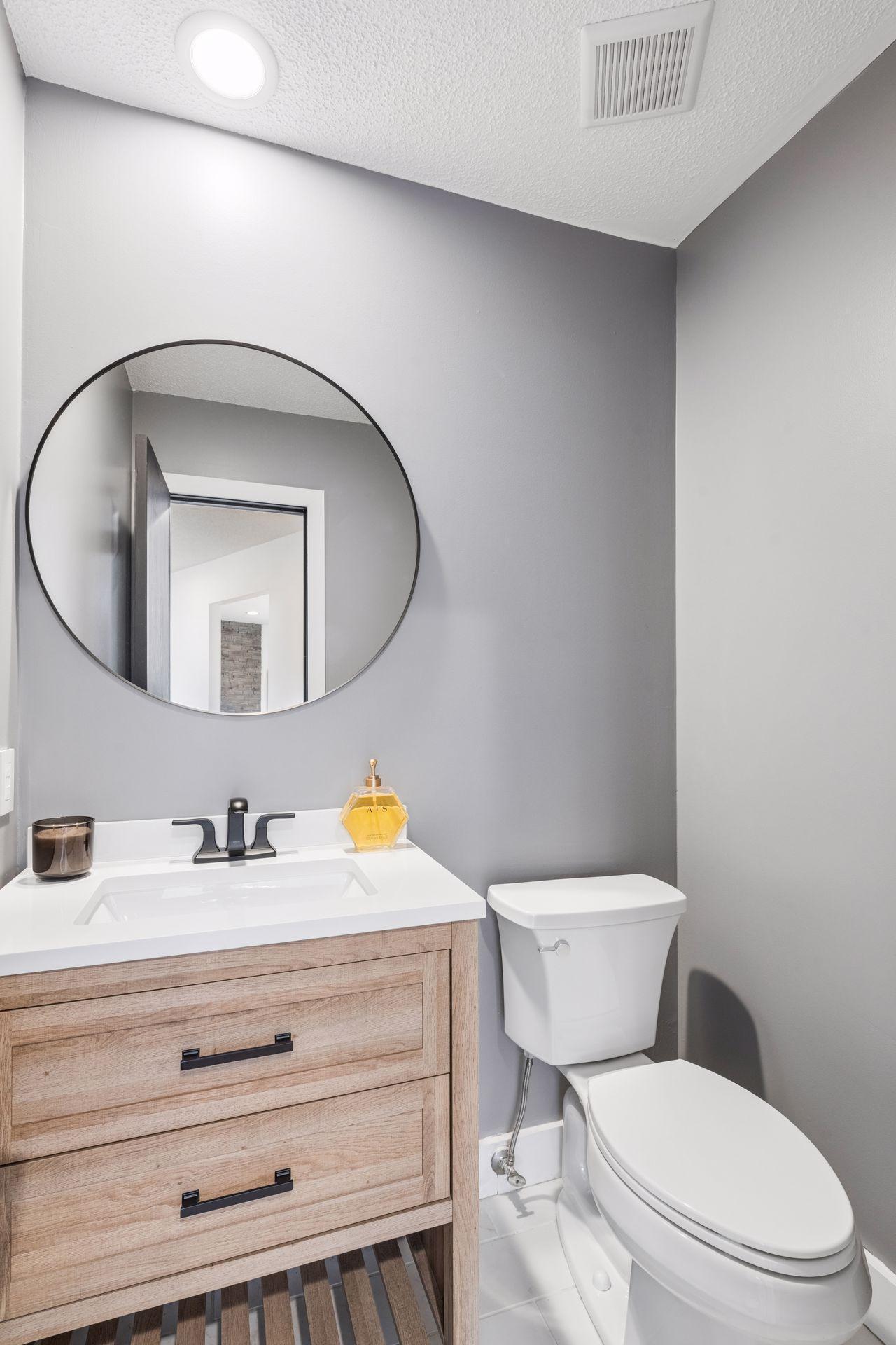 Main floor powder room. All bathrooms in the home have been renovated.