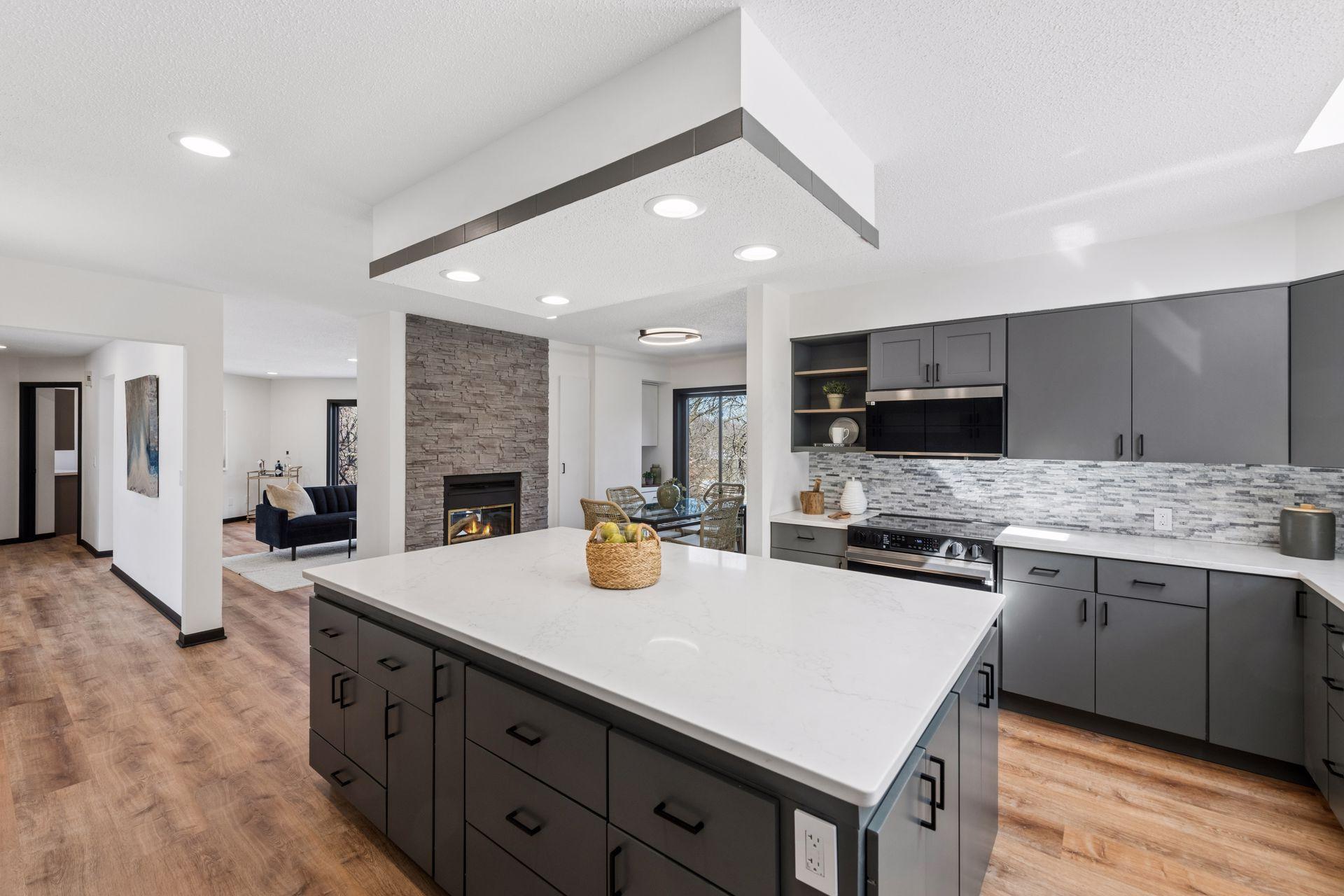Renovated chef’s kitchen with large center island.