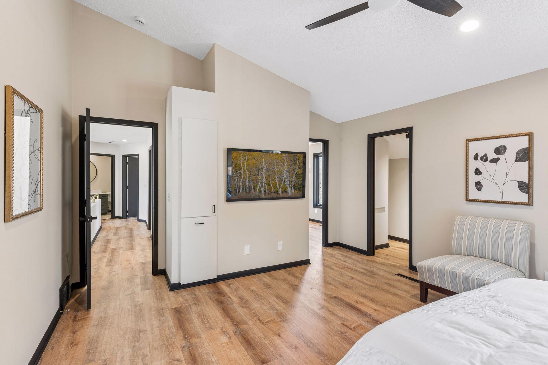 Primary suite, with built-in storage cabinets and additional walk-in closet.