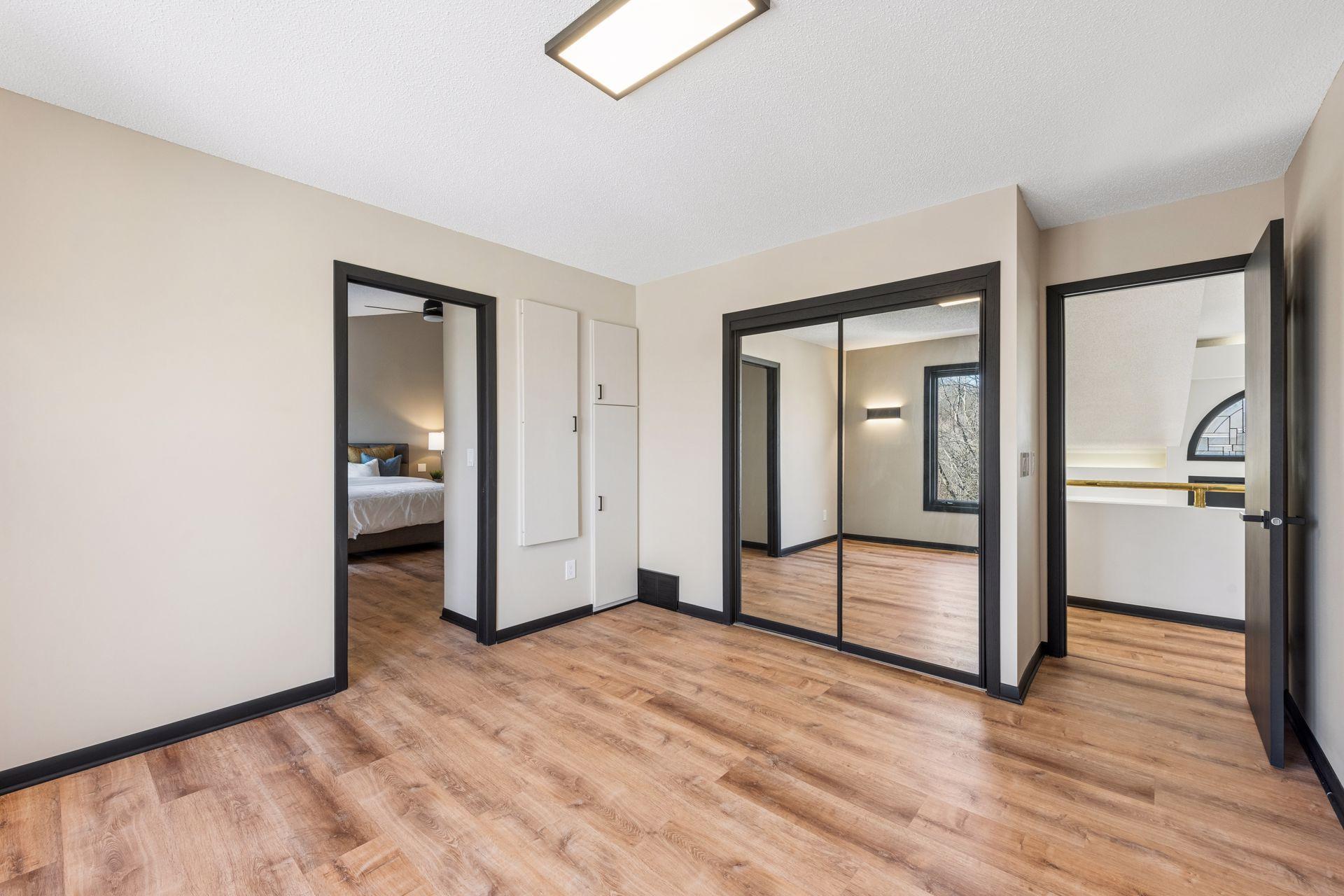 Second bedroom upstairs, with access to the primary suite and hallway.