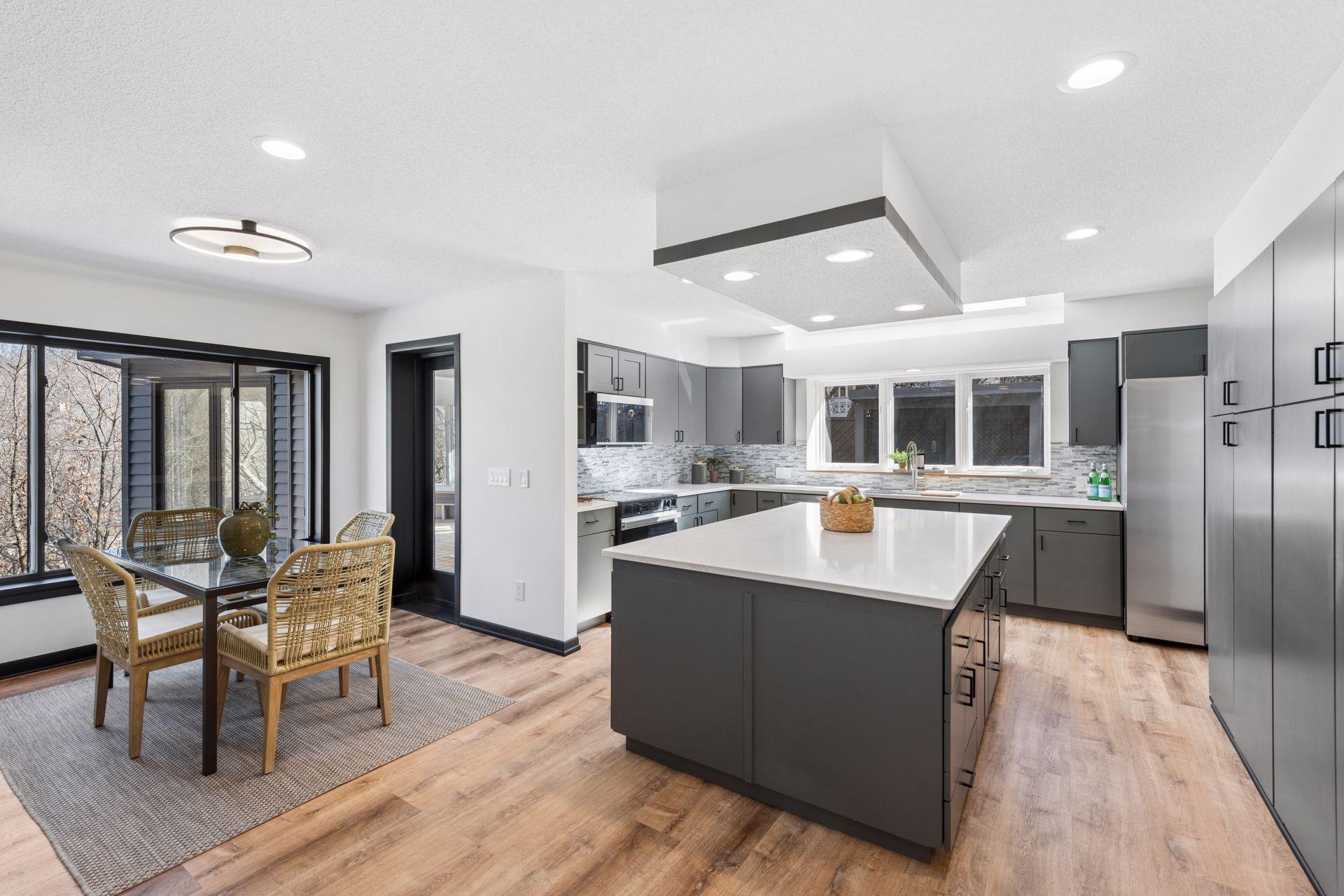 Convenient informal dining adjacent to the kitchen, overlooking the serene backyard.