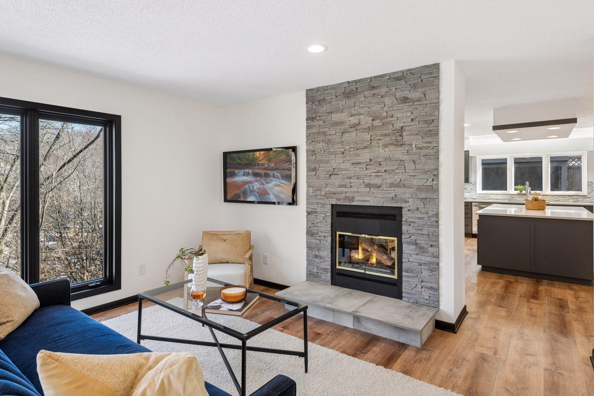 Main floor sitting room with double-sided gas fireplace.