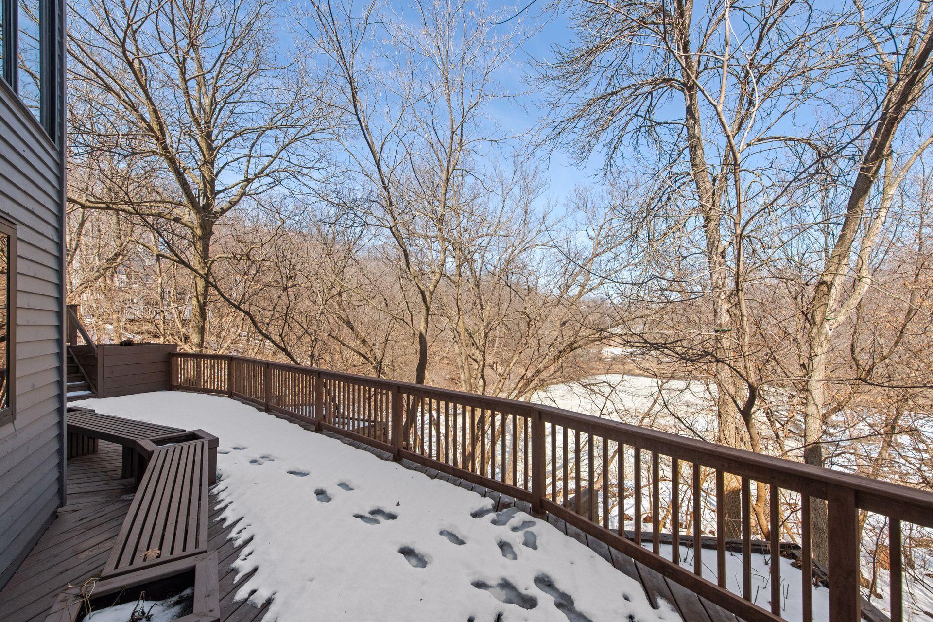 Large back deck with built-in benches and planters.