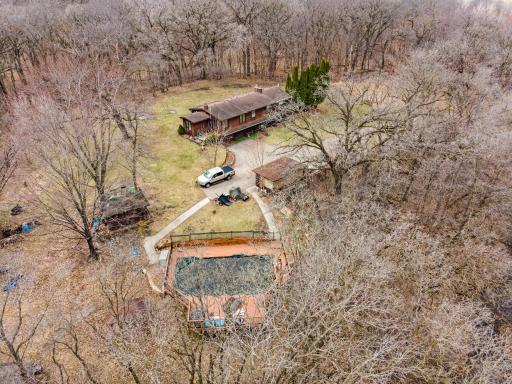Pool, pool house/sauna, screened gazebo, a couple storage sheds...all usable but need some TLC.