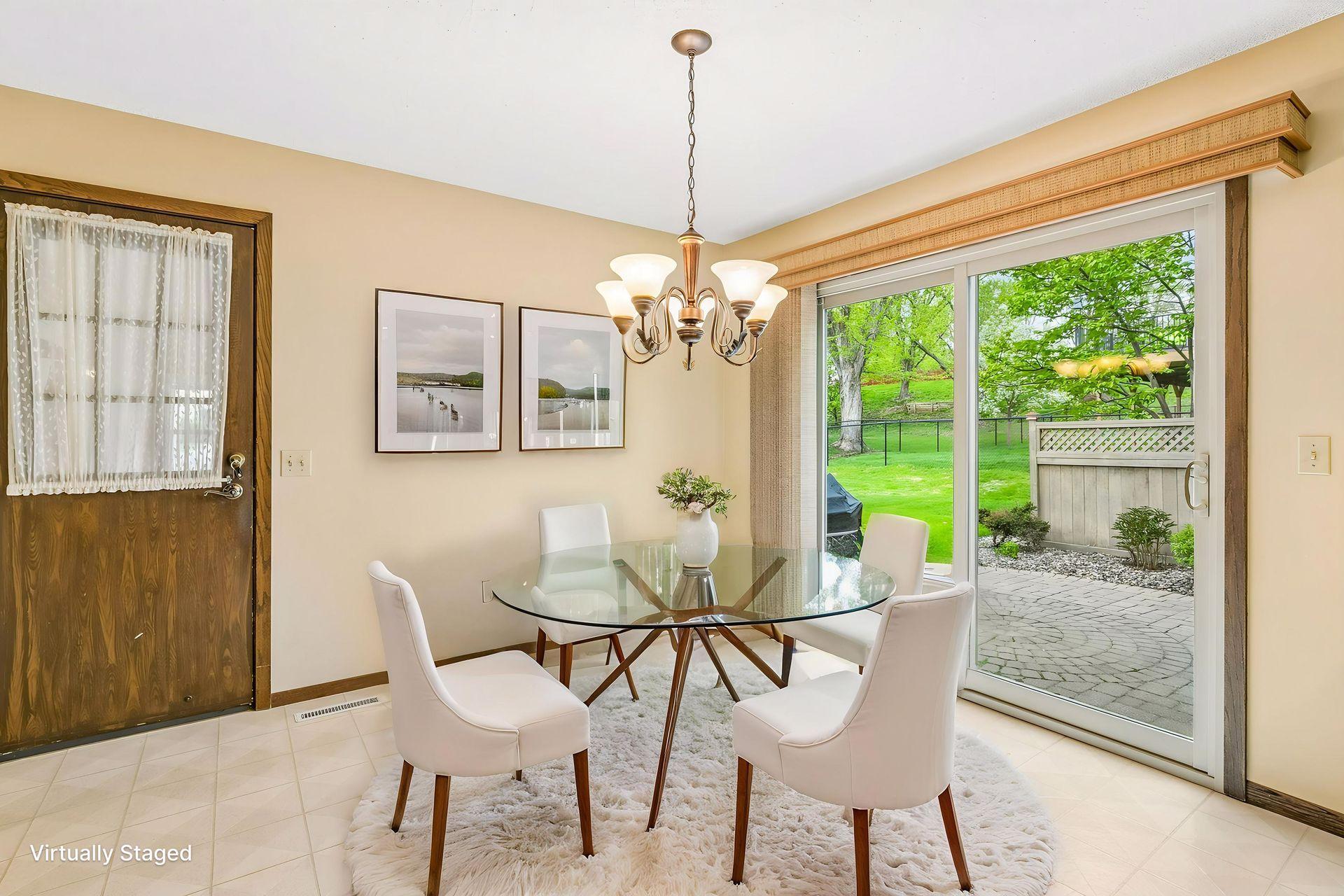 Virtually Staged Informal Dining walking out to paver patio