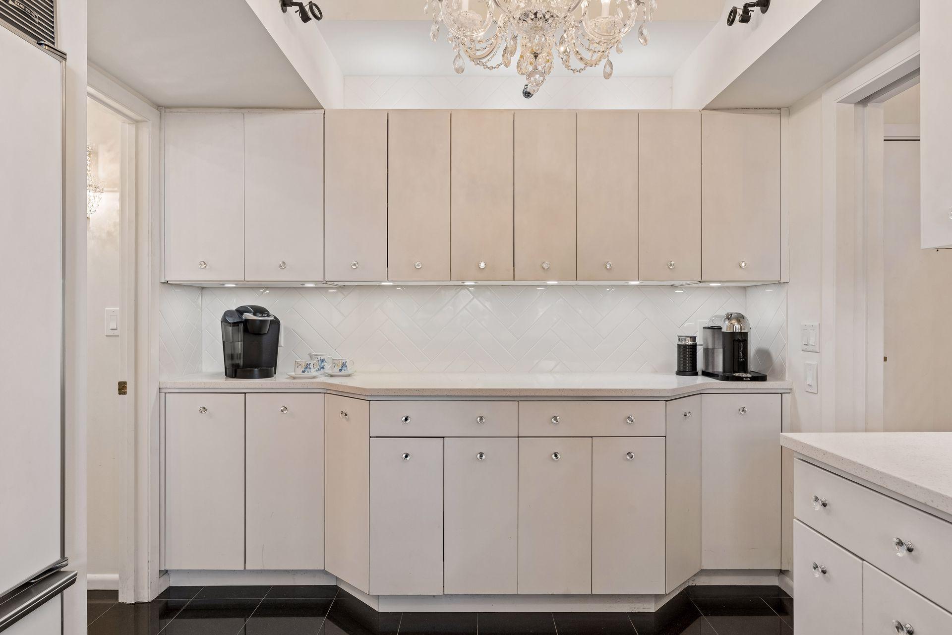 Plentiful counter space for small appliances, coffee station and horderves during parties/gatherings at your place. Plus Cabinet space galore!