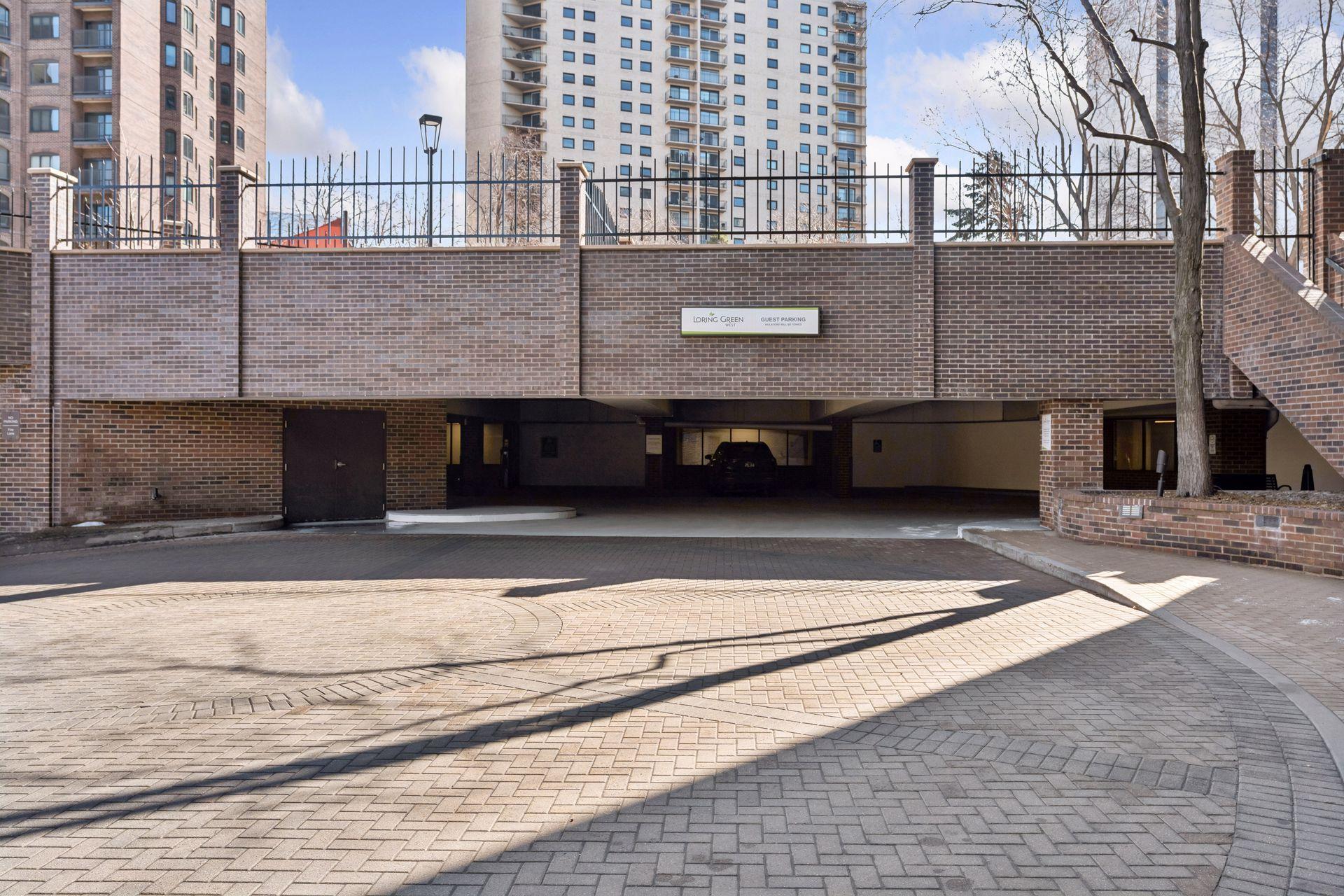 Guest parking to the left; Your parking entrance to the right