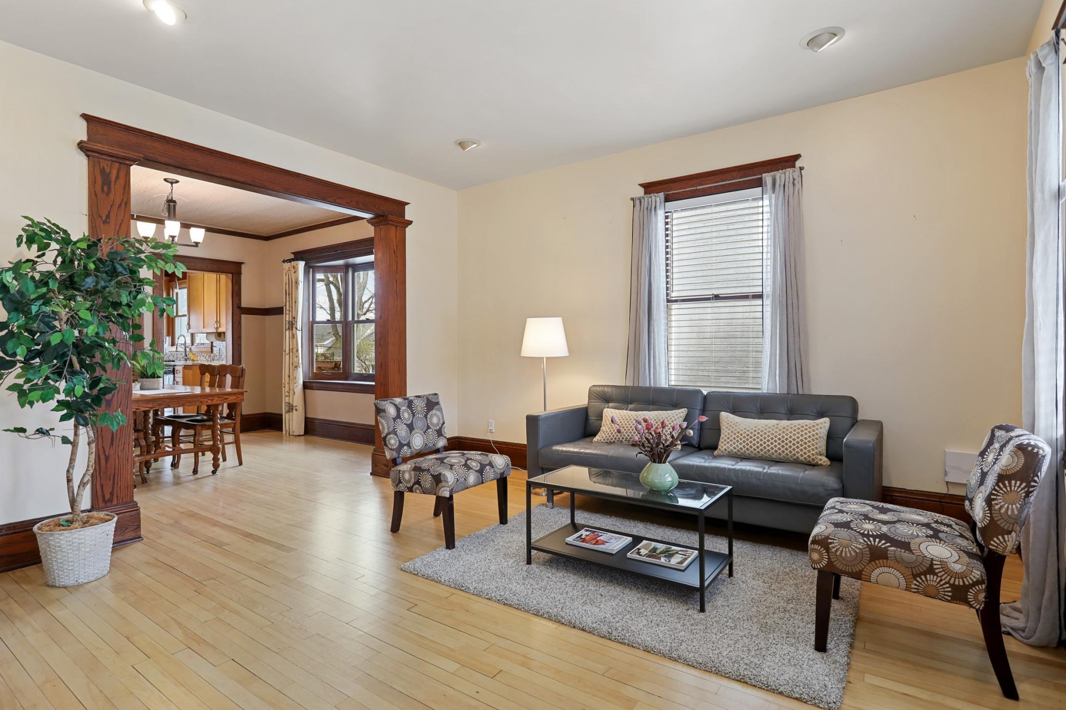 Living Room into Dining Room, Charming Woodwork and Hardwood Floors!