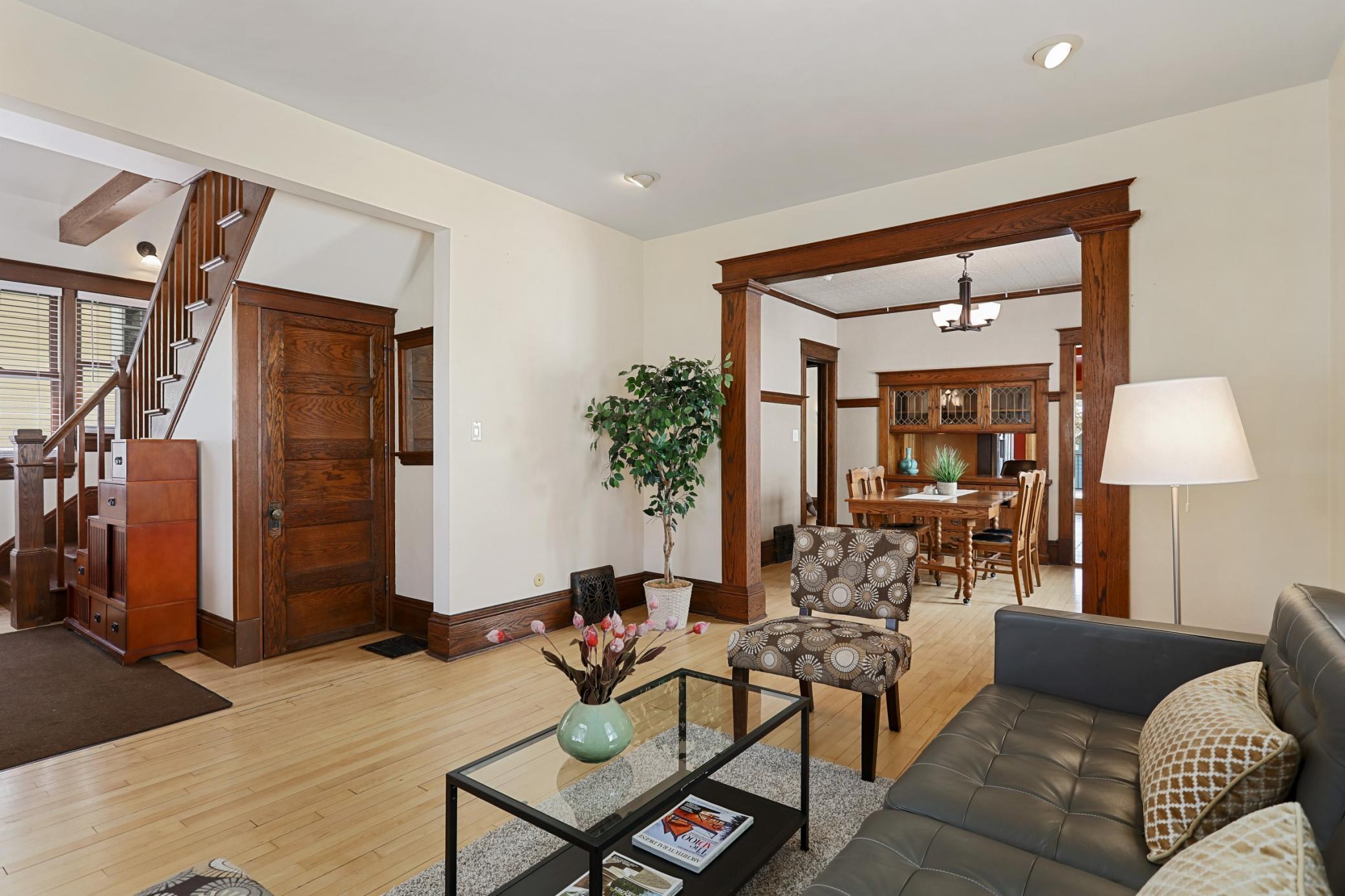 Living Room into Dining Room, Charming Woodwork and Hardwood Floors!