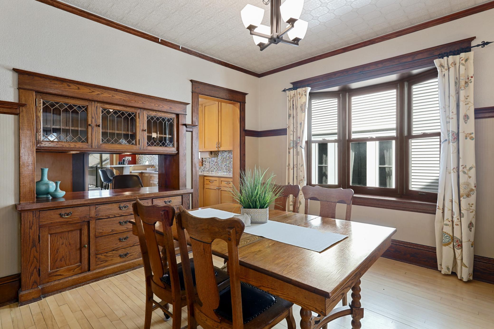 Gorgeous Woodwork in Dining Room, Featuring Built-in with Pass Through Into the Updated Kitchen!