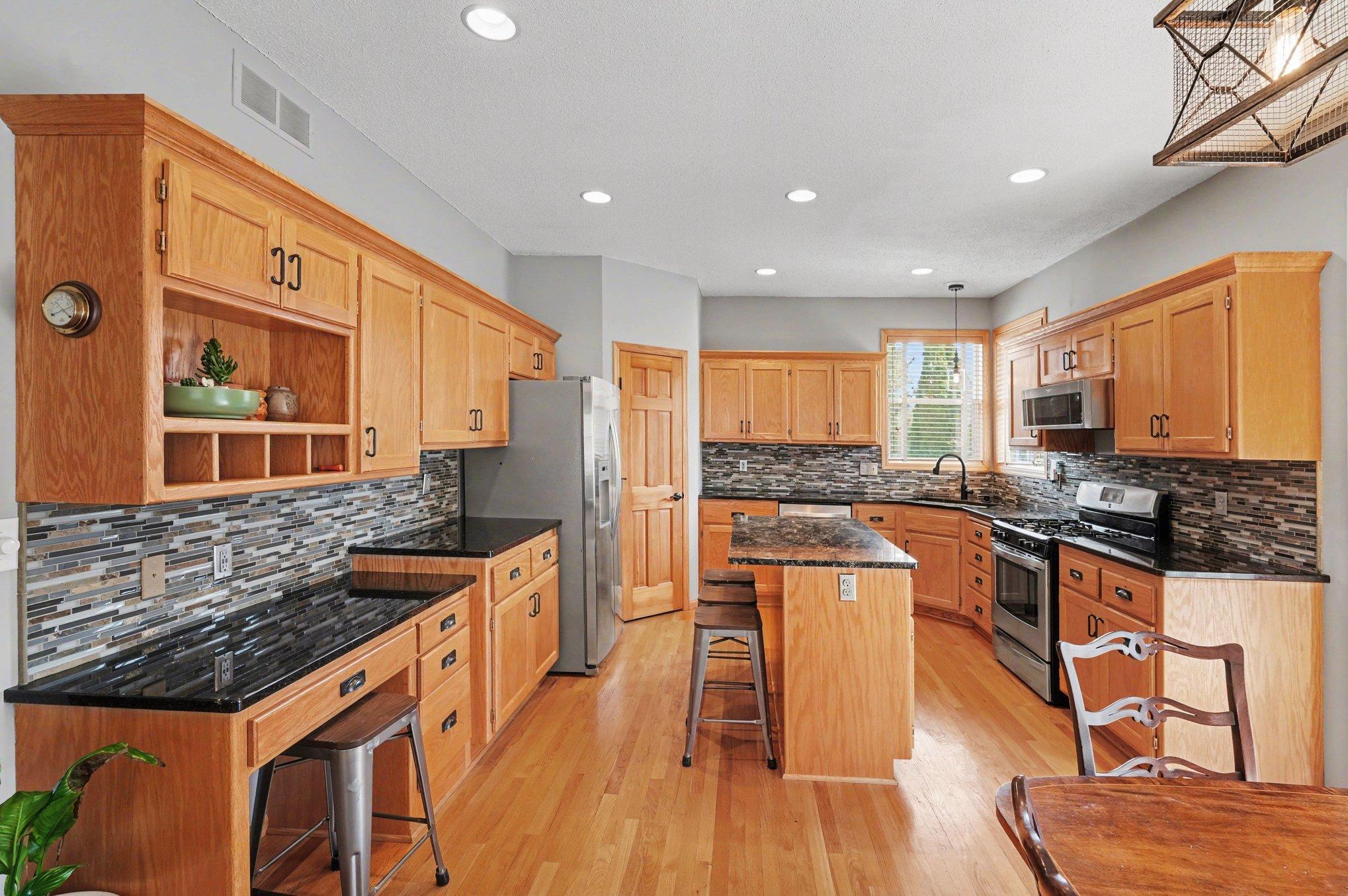 Tons of work & storage space in this gourmet kitchen.