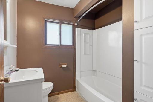 This main level bathroom is renovated and located right near the kitchen and common living spaces