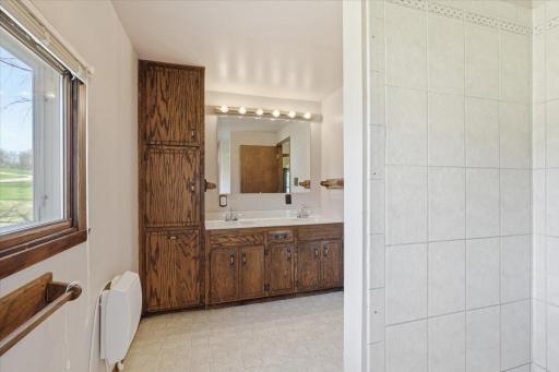 This large bathroom with ample storage is between the 3 bedrooms in the upstairs level
