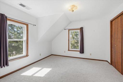 Bedroom 2, also located upstairs with a large closet