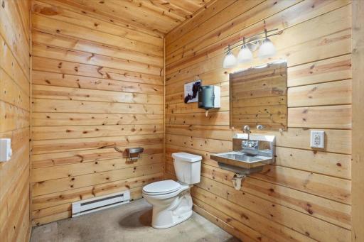 Bathroom with attached utility room within stables for owners, guests and/or clients