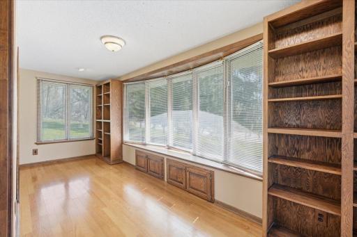 The enclosed porch is a beautiful space with an additional door onto the deck