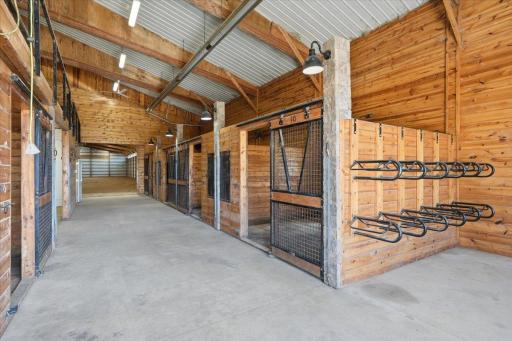 Beautiful saddle racks and tack area near these stunning, custom stalls