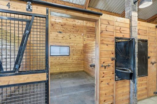 Spacious stalls with fans, great air flow, auto-waterers, feed doors and mats