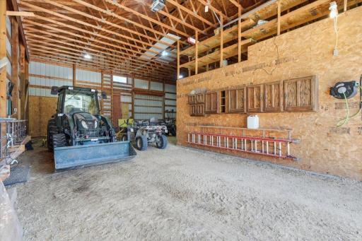 Cold storage aside the shop with additional storage above in the loft is perfect for trailers, tractors and various equipment
