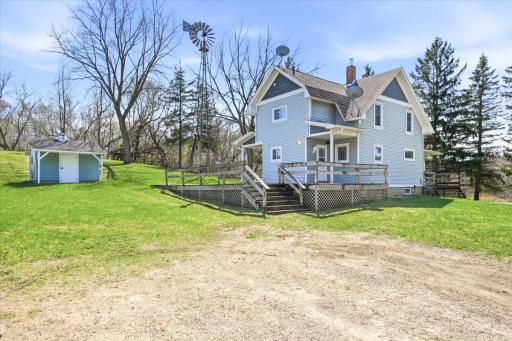 This farm house with the large deck and classic windmill have all the charm one could ask for