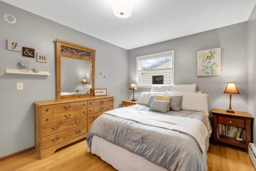 Primary bedroom. A cozy, but functional size. All main level bedrooms have the original hardwood floors.