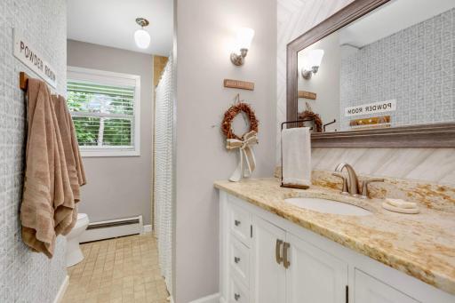 This is the main level bathroom. It's a wonderful size, with a granite top vanity, and real tile flooring and tile shower surround.