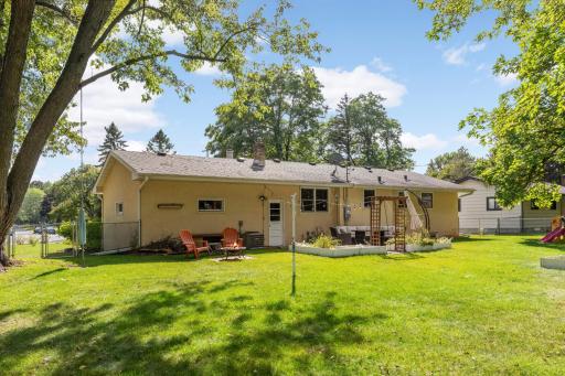 The backyard has a generously sized patio great for relaxing or entertaining, surrounded by garden boxes for you to enjoy your favorite flowers or veggies.