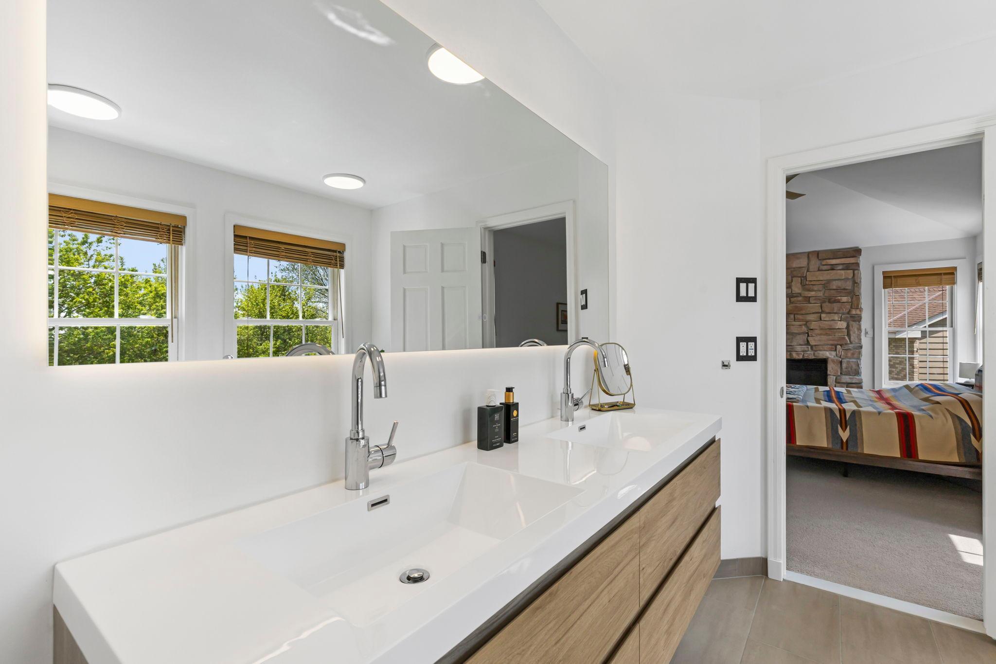 Double vanity with heated, backlit mirror
