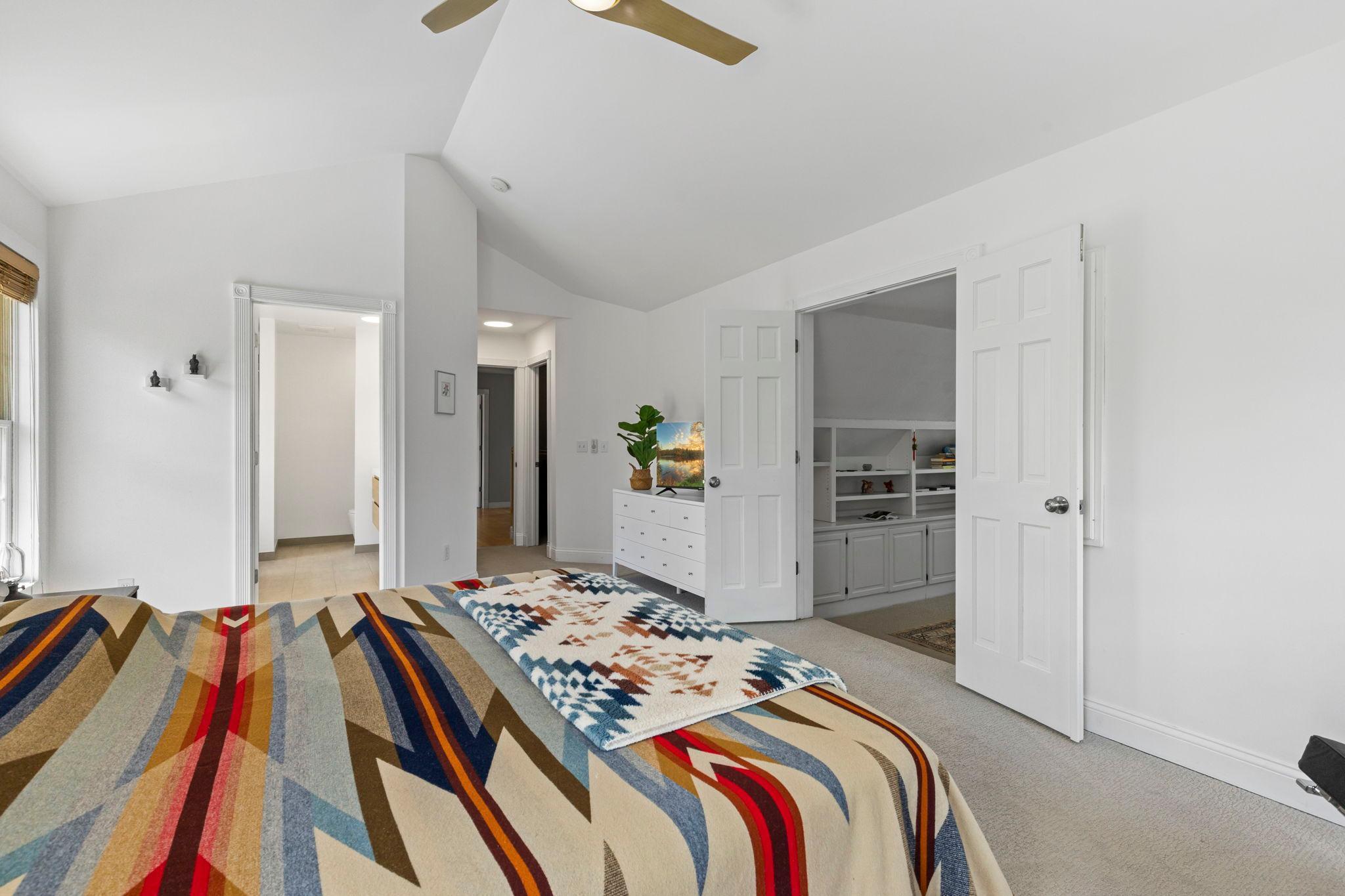 Primary bedroom with private bath, walk-in closet, and bonus room