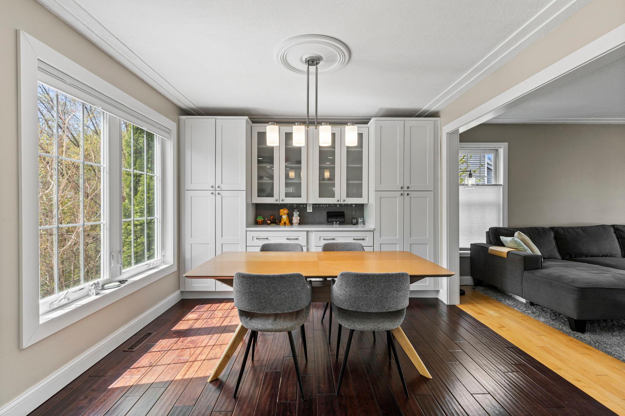 Built-in hutch and light filled dining room