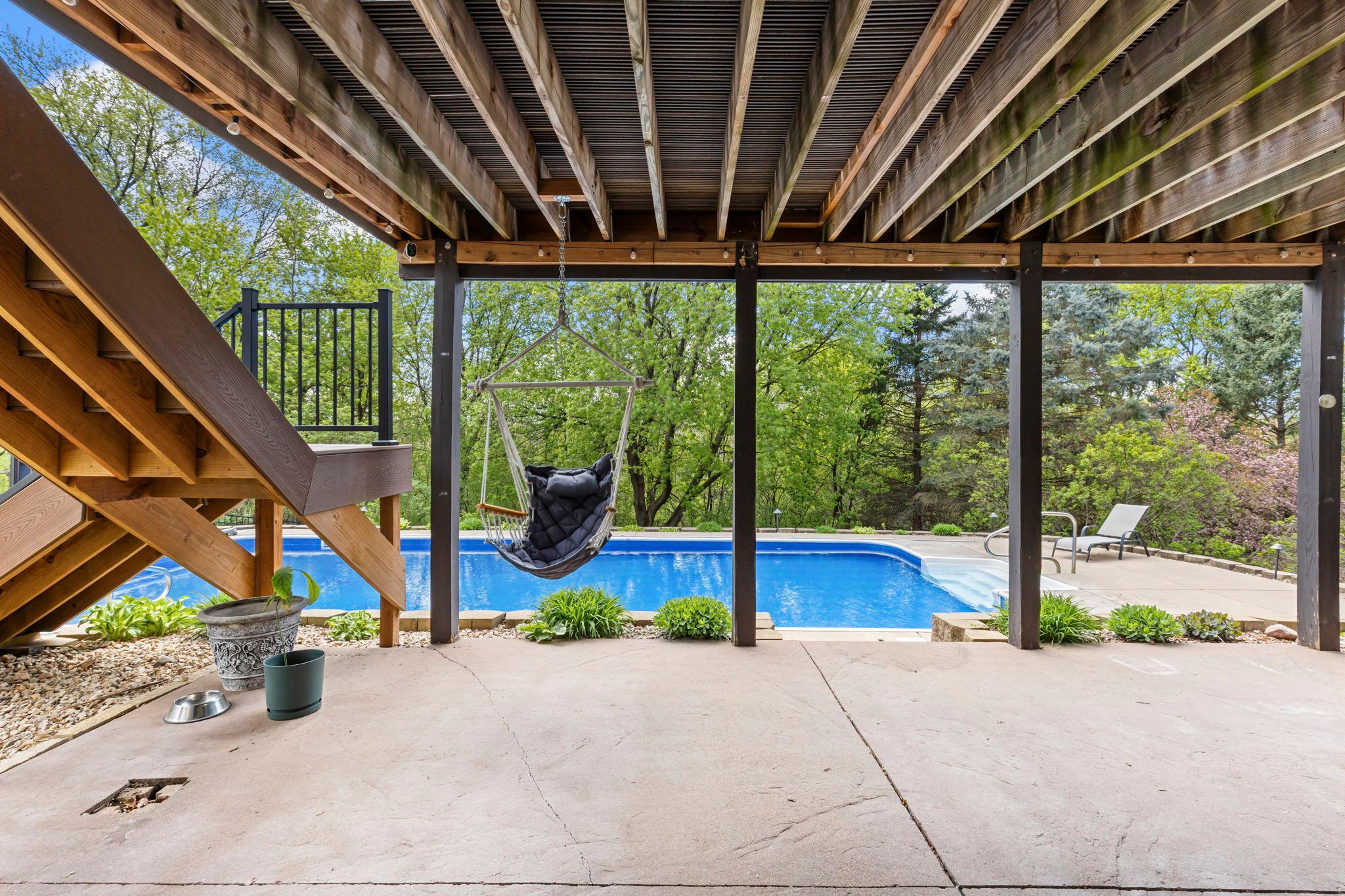 Lower level patio overlooks the pool