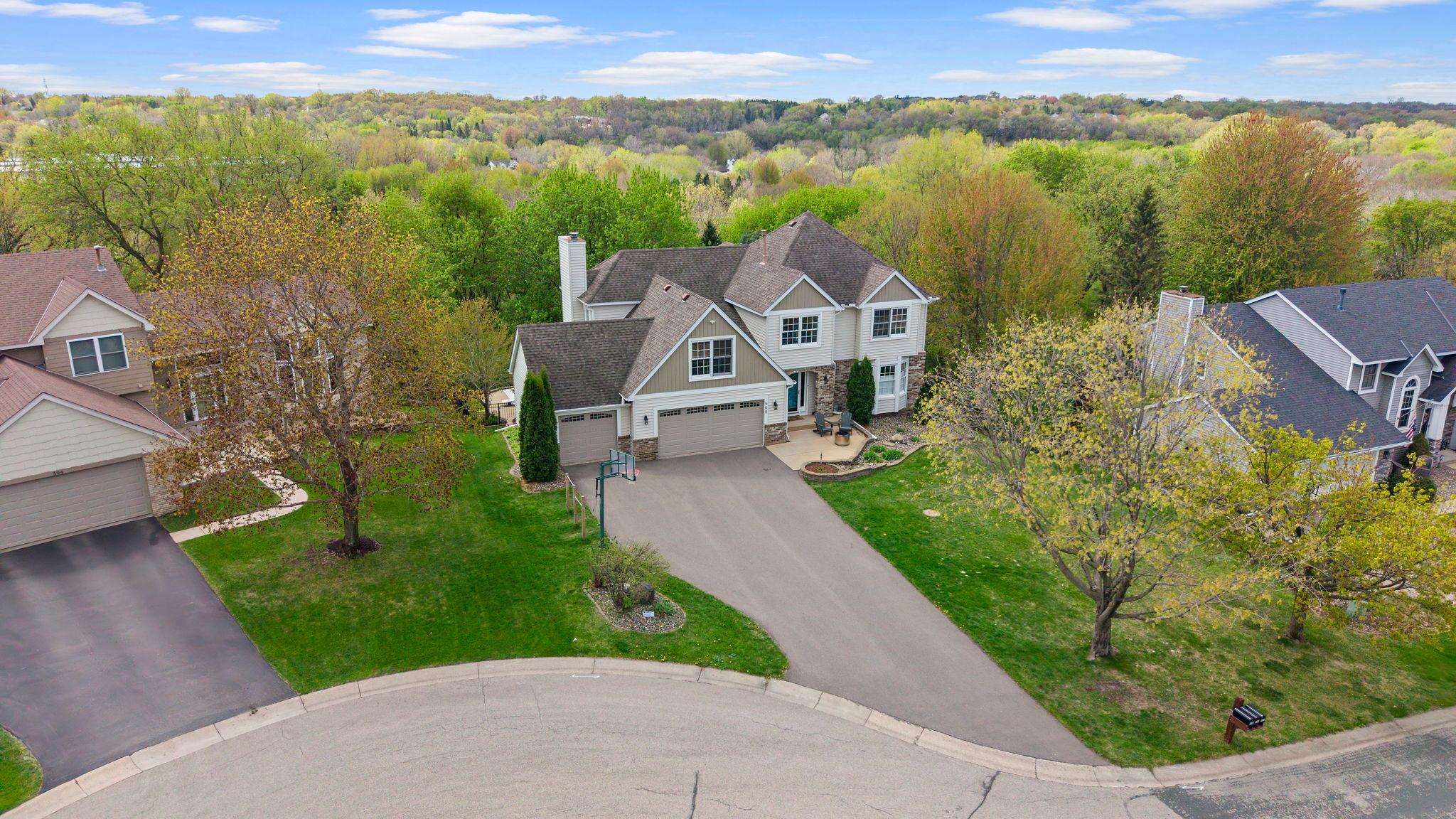 Cul-de-sac location surrounded by private woods