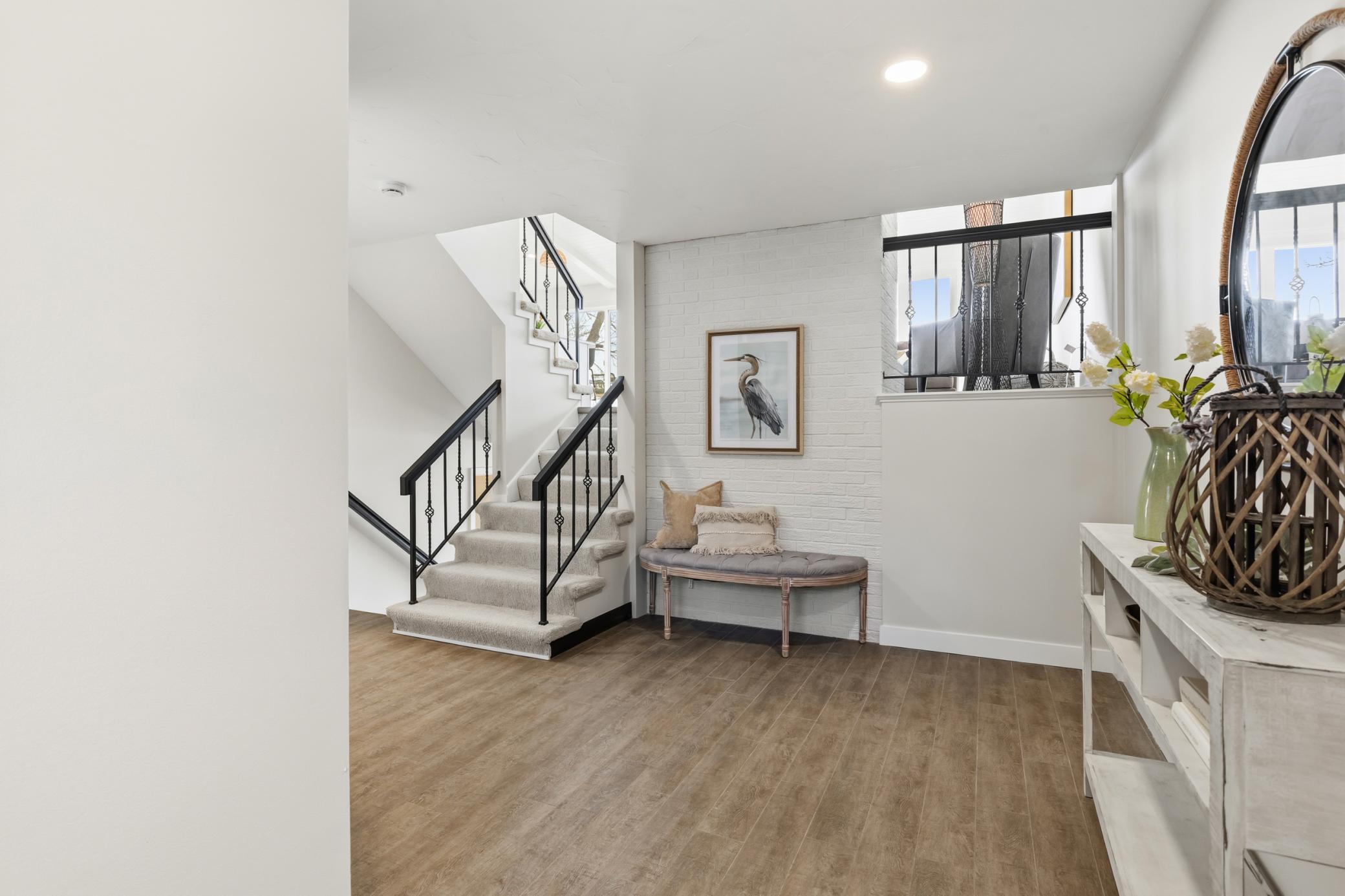 Foyer features charming shaker style entry door and ceramic tile flooring