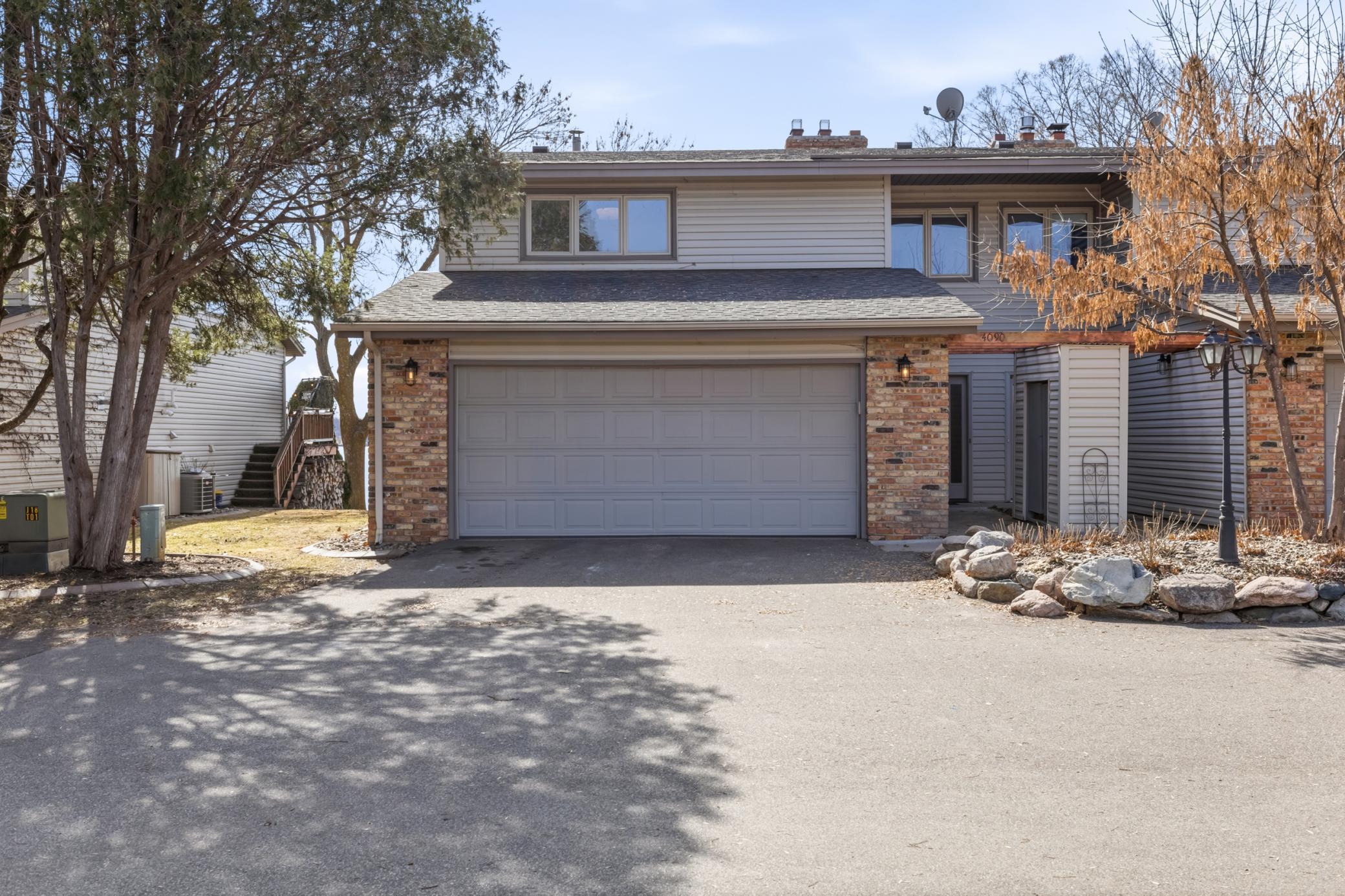 2-car garage offers epoxy coated floors and built-in shelving