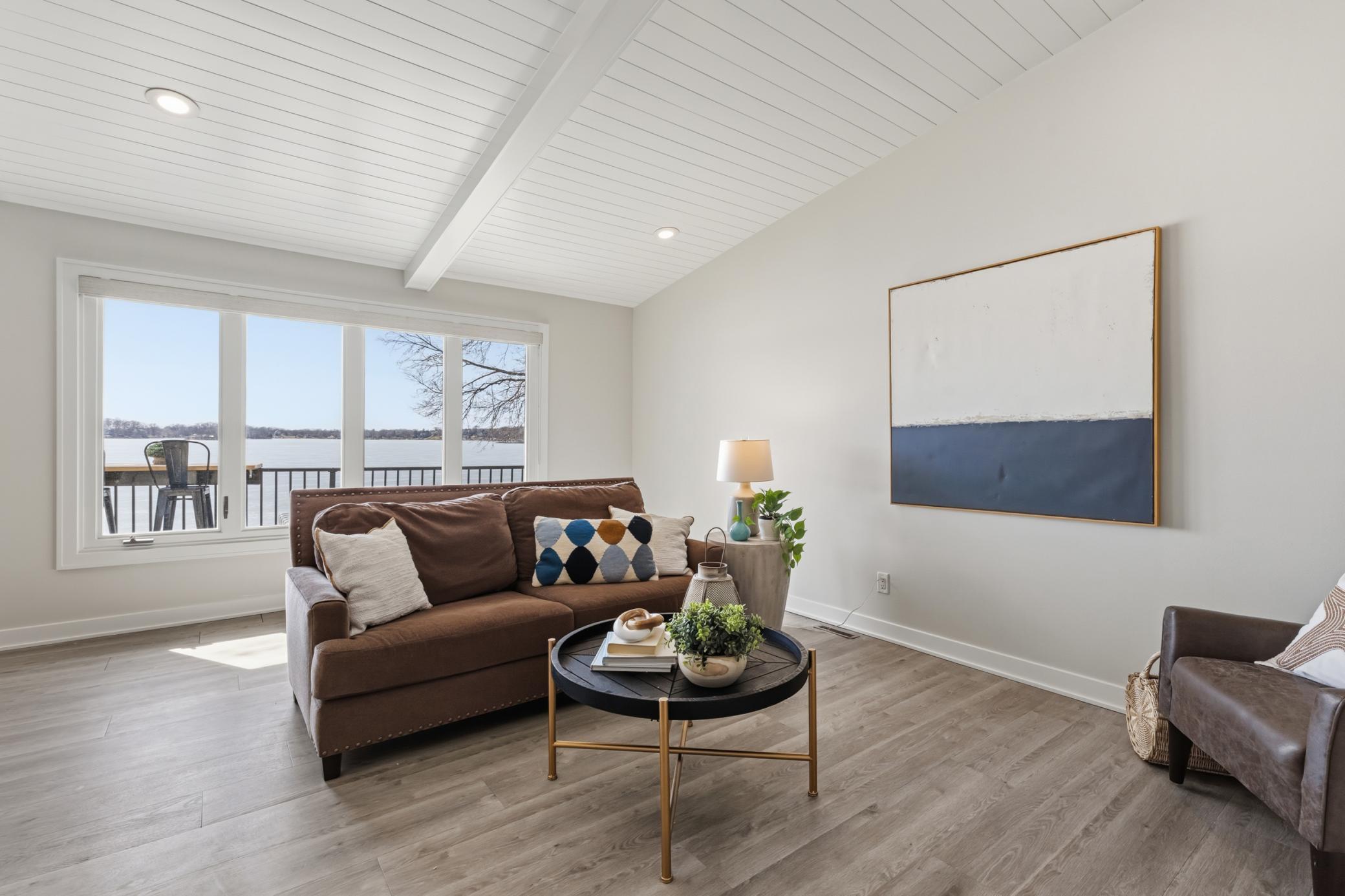 Living Room features large windows that offer stunning views of Upper Prior Lake!