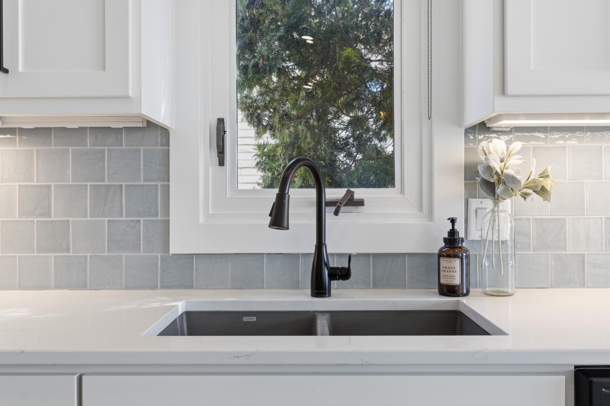 Quartz countertops with tile backsplash