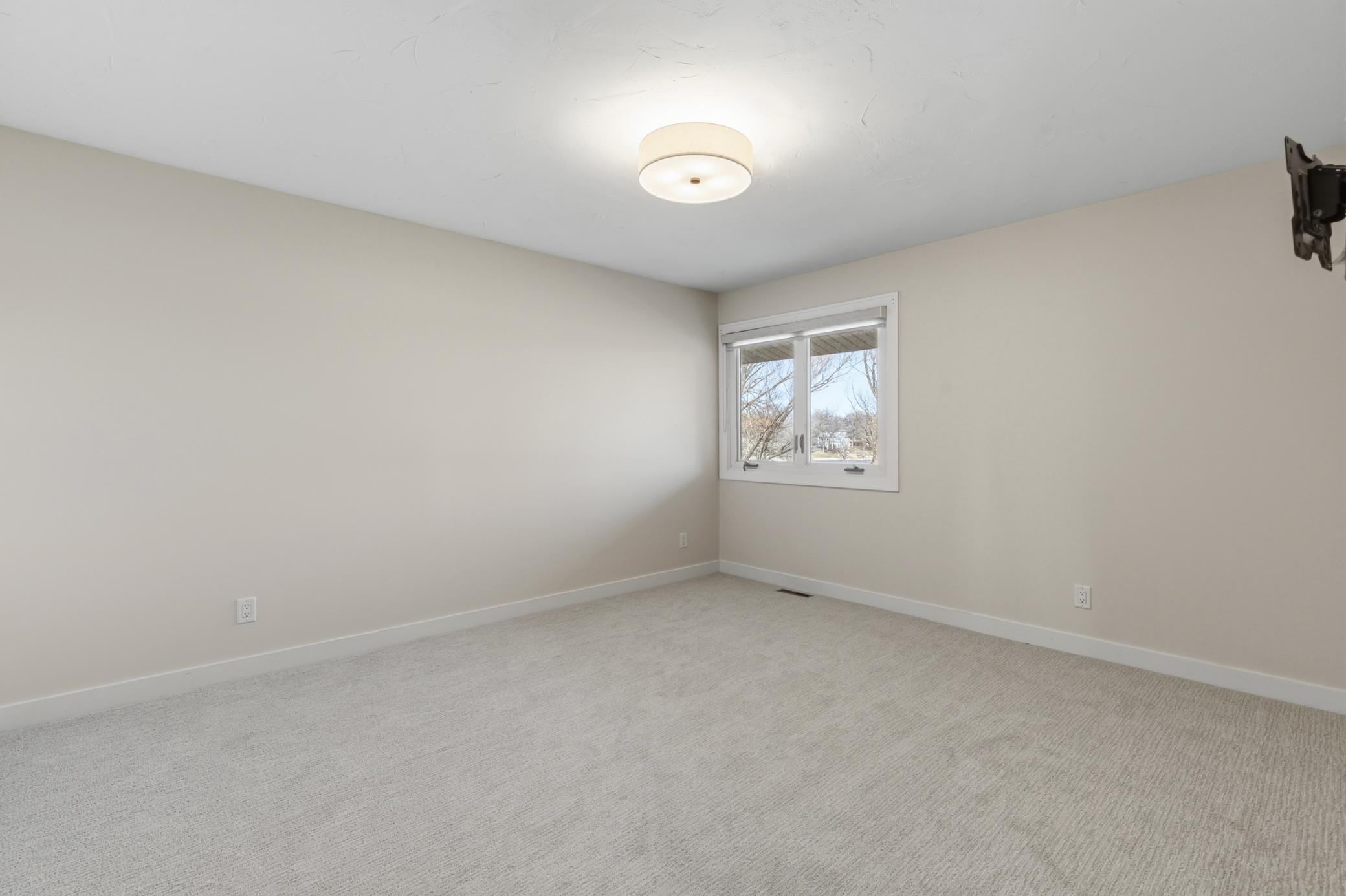 Bedroom 2 features pair of closets and new carpet