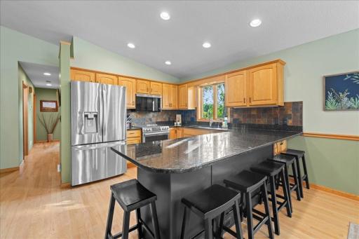Granite countertops and stainless steel appliances.