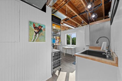 Laundry room with large stainless steel utility sink.