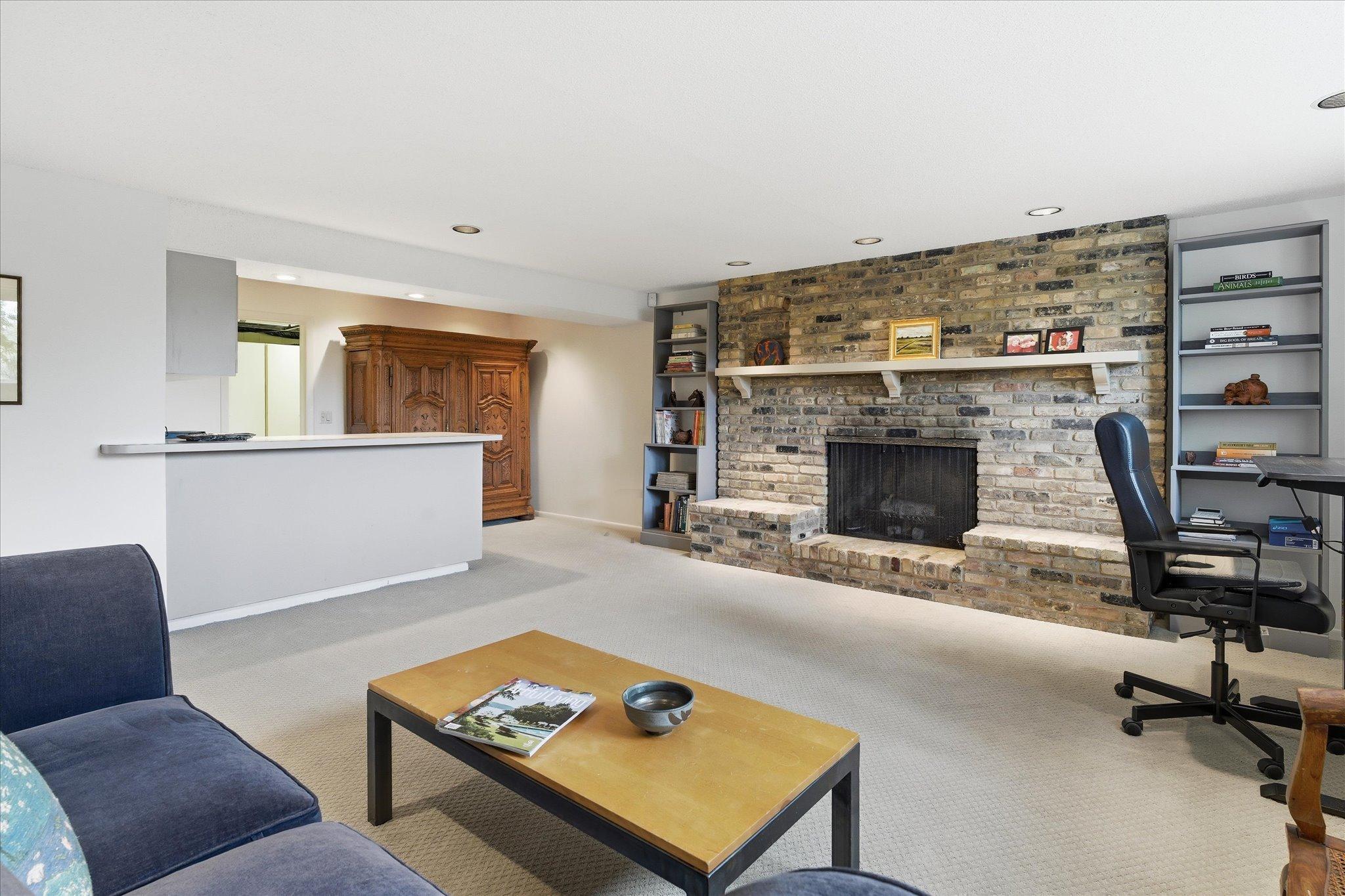 Lower level family room has an attached bar