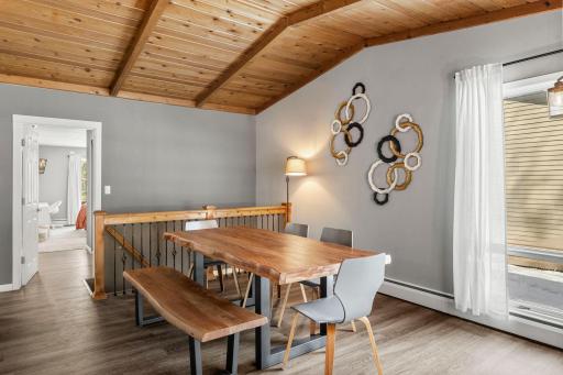 A fresh perspective of the formal dining room, highlighting the entrance to the primary bedroom.