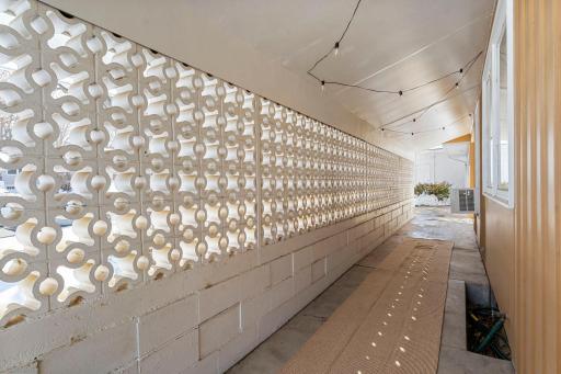 A unique enclosed front patio welcomes you at the entrance, offering a cozy spot to relax.