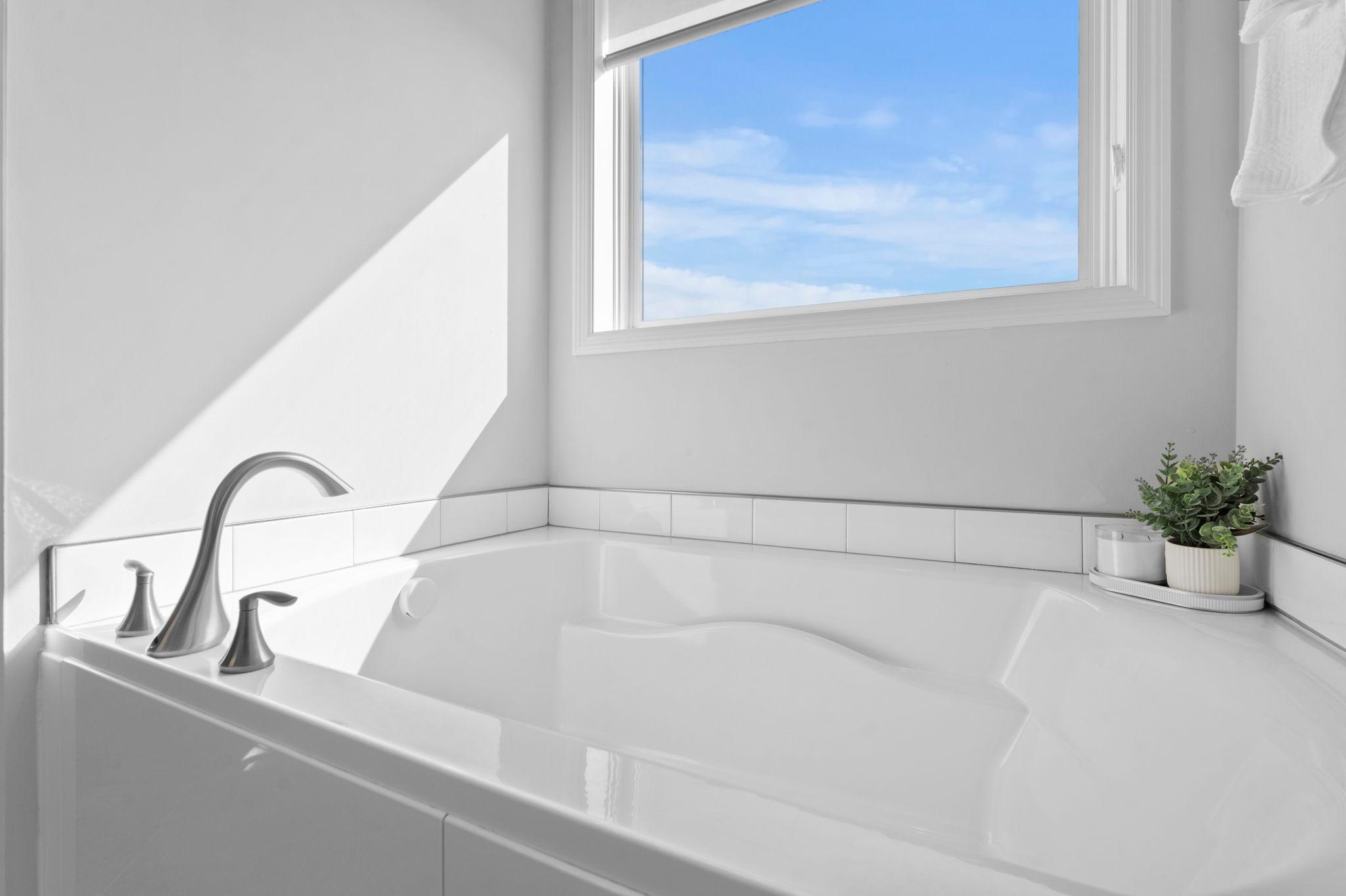A closer look at the oversized soaking tub, perfect for ultimate relaxation.